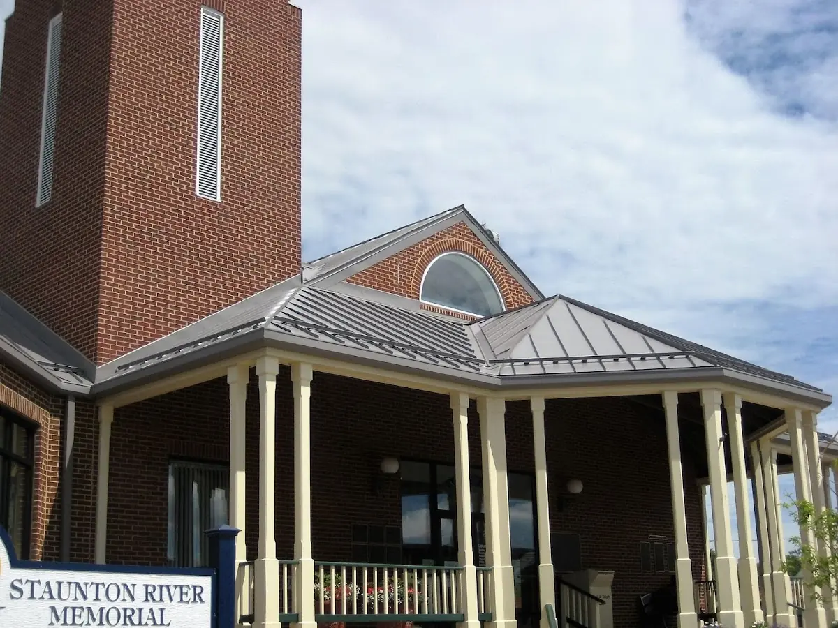 Skilled roofing craftsmen working on a residential roof in Battle Creek